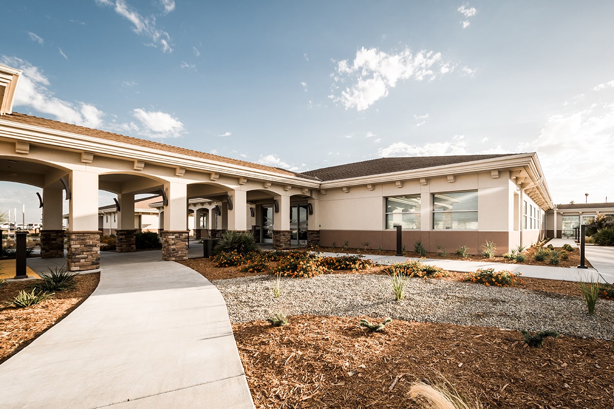Kern River Transitional Care sidewalk back view with blue skies