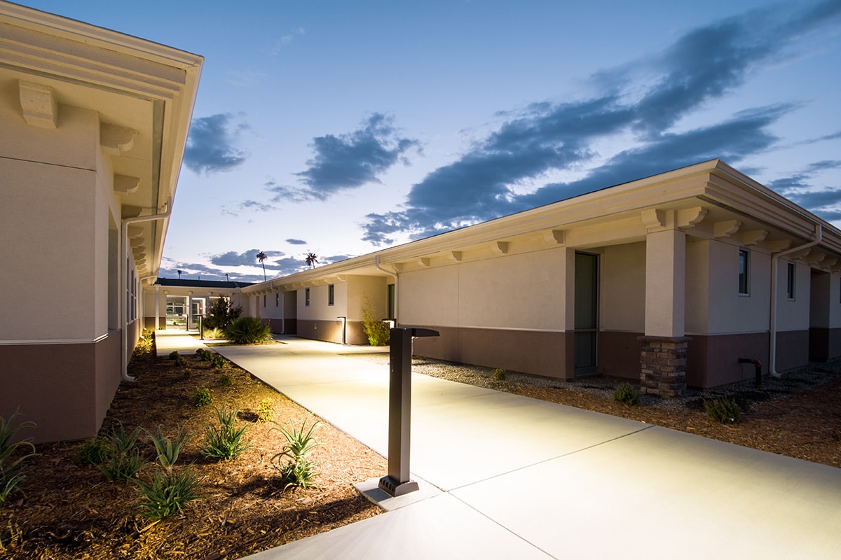 Kern River Transitional Care sidewalk back view at sunset