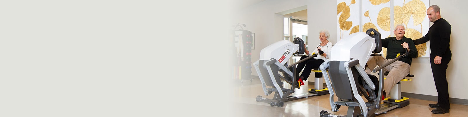 rehab therapist with residents in the rehab gym at Kern River Transitional Care