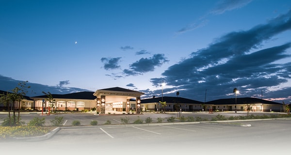the front of the Kern River facility at dusk