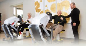 rehab therapist with residents in the rehab gym at Kern River Transitional Care