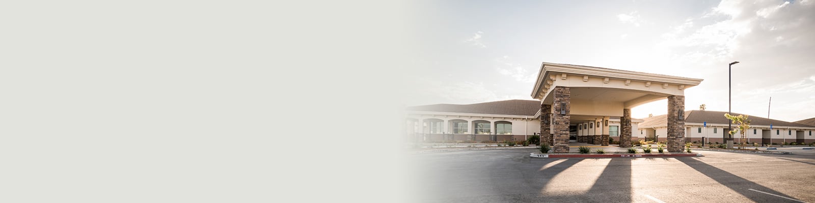 Kern River Transitional Care front entry view with blue skies