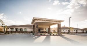 Kern River Transitional Care front entry view with blue skies