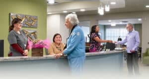 nurses with residents at the nurse's station at Kern River Transitional Care